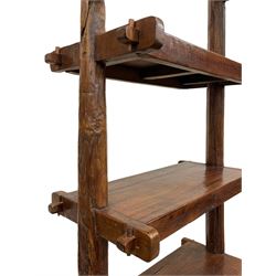 Chinese hardwood free standing bookcase or shelving unit, two naturalist branch uprights supporting four shelves, with Chinese export stamp