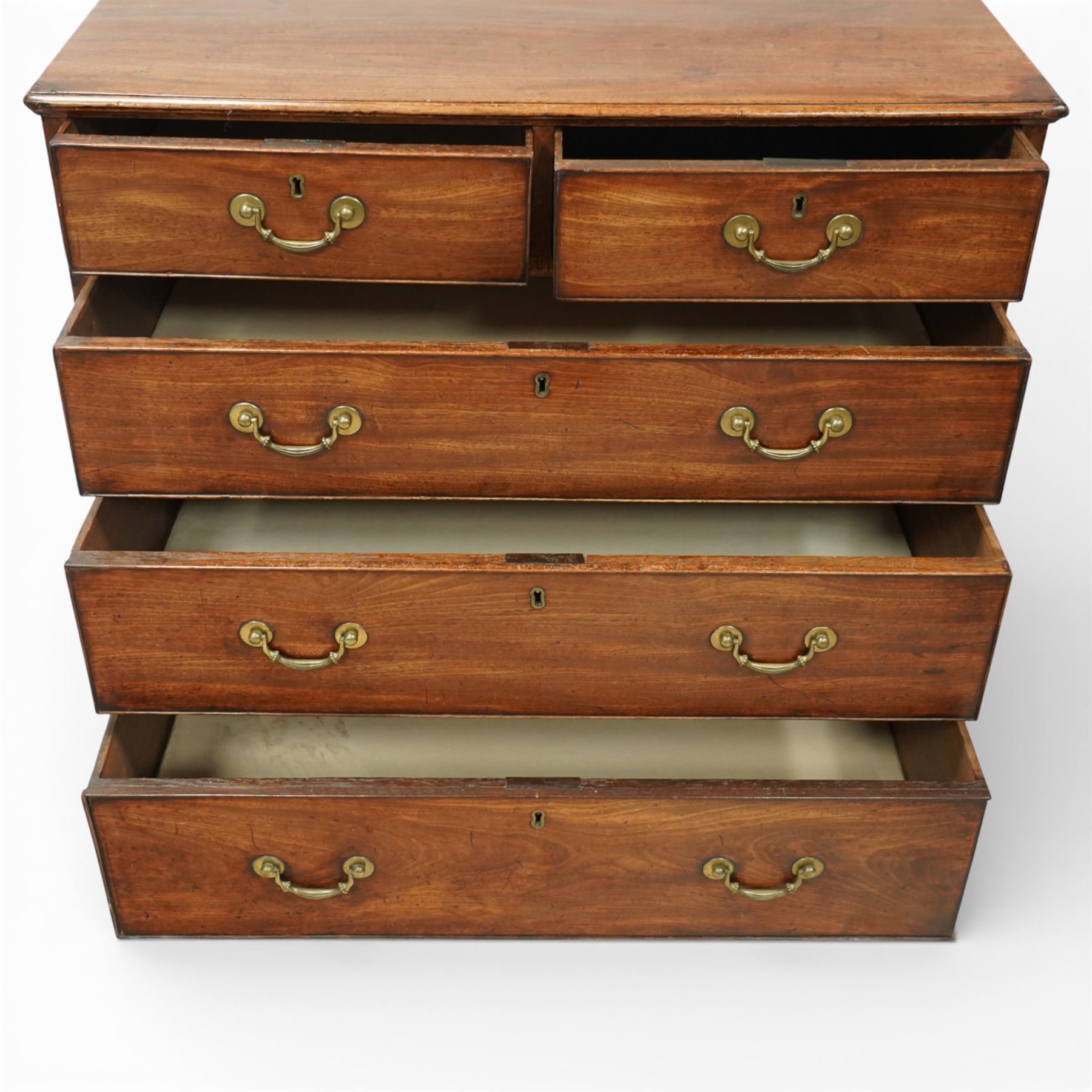 George III mahogany chest of drawers, moulded rectangular top over two short and three long drawers, plain frieze, the drawers fitted with brass swan neck handles and pierced escutcheons, raised on shaped bracket feet