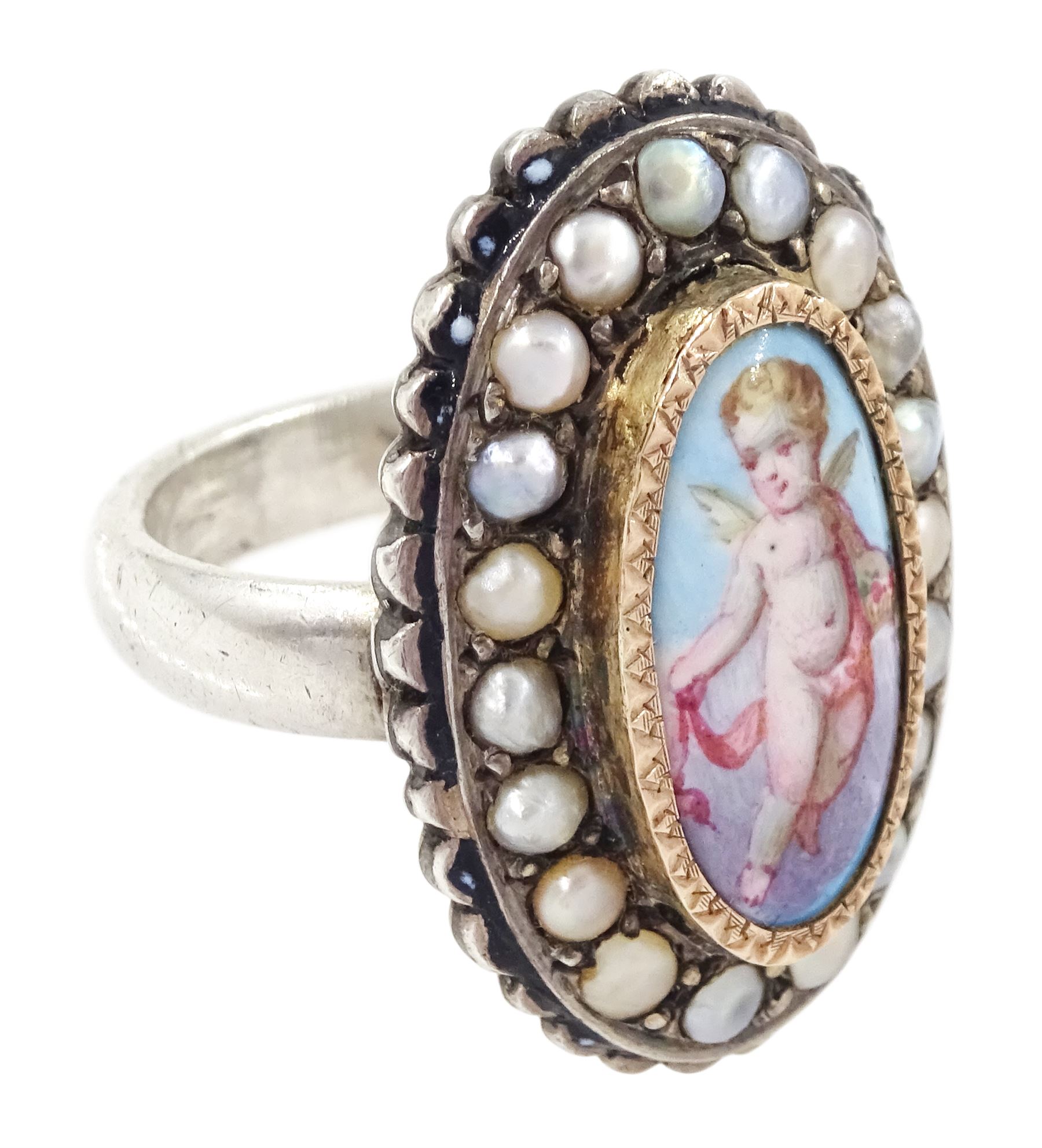 19th century French silver enamel portrait ring, set with an oval hand painted panel of a cherub, with split pearl surround