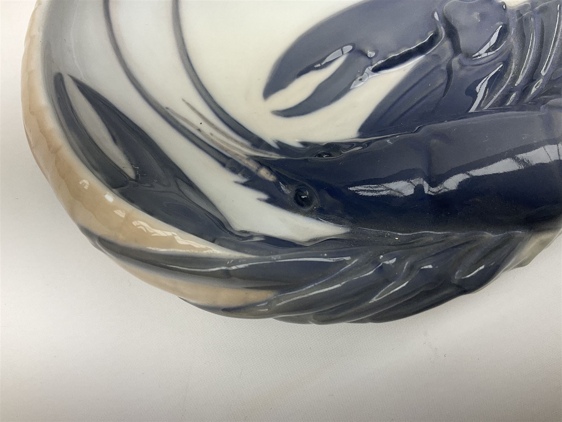 Pair of Royal Copenhagen bowls modelled as baskets and mounted with lobsters, model no 3498 and 3277, with painted and printed marks beneath, largest D19cm