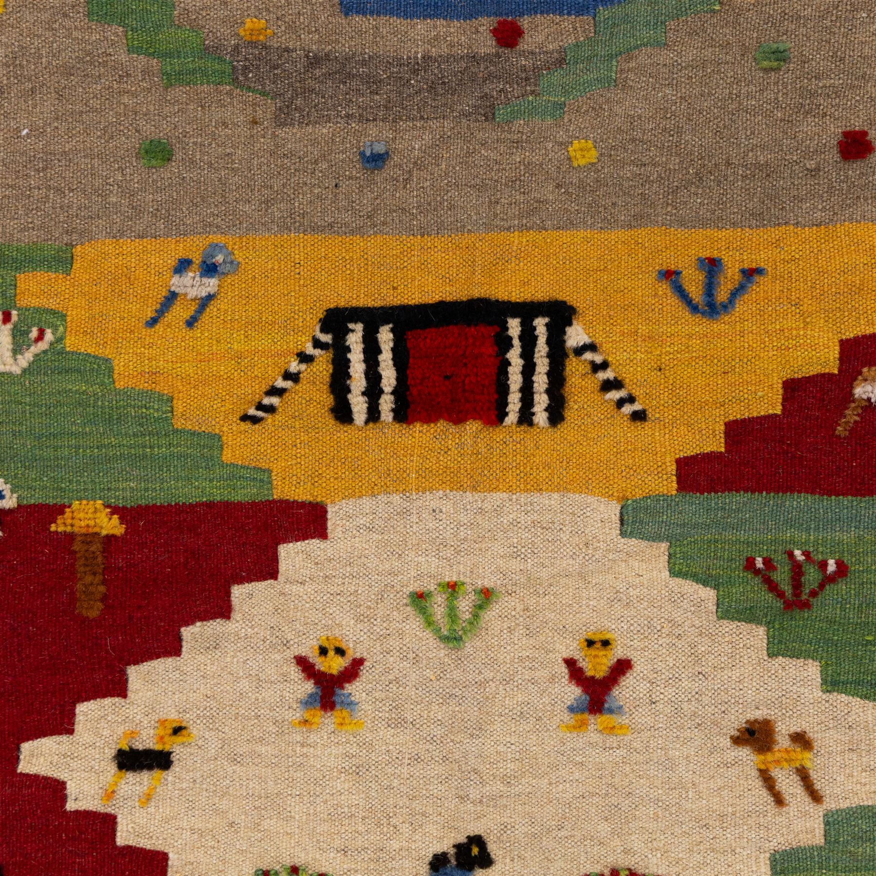 South West Persian Qashqai pictorial flatweave kilim, polychrome field divided into stepped geometric panels decorated with stylized animals, bird, fish and tree motifs with a central ivory lozenge medallion beneath a simple landscape panel with tent motif, figures and and narrow multi-coloured border applied in raised wool pile against a flat-woven ground, fringe ends  