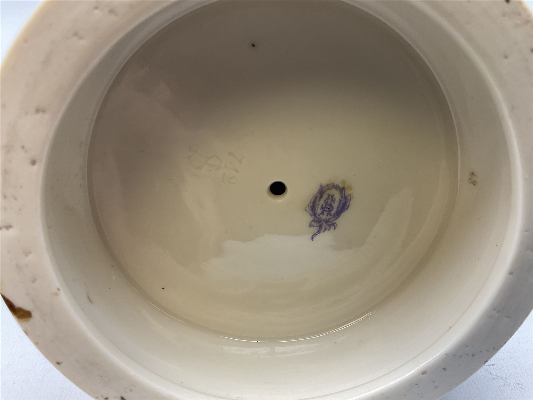 Late 19th century continental spill vase as a young girl standing beside an open tree trunk H21cm; and three German bisque figures (4)