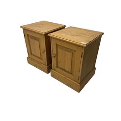 Pair pine bedside cabinets, fitted with single panelled cupboard door