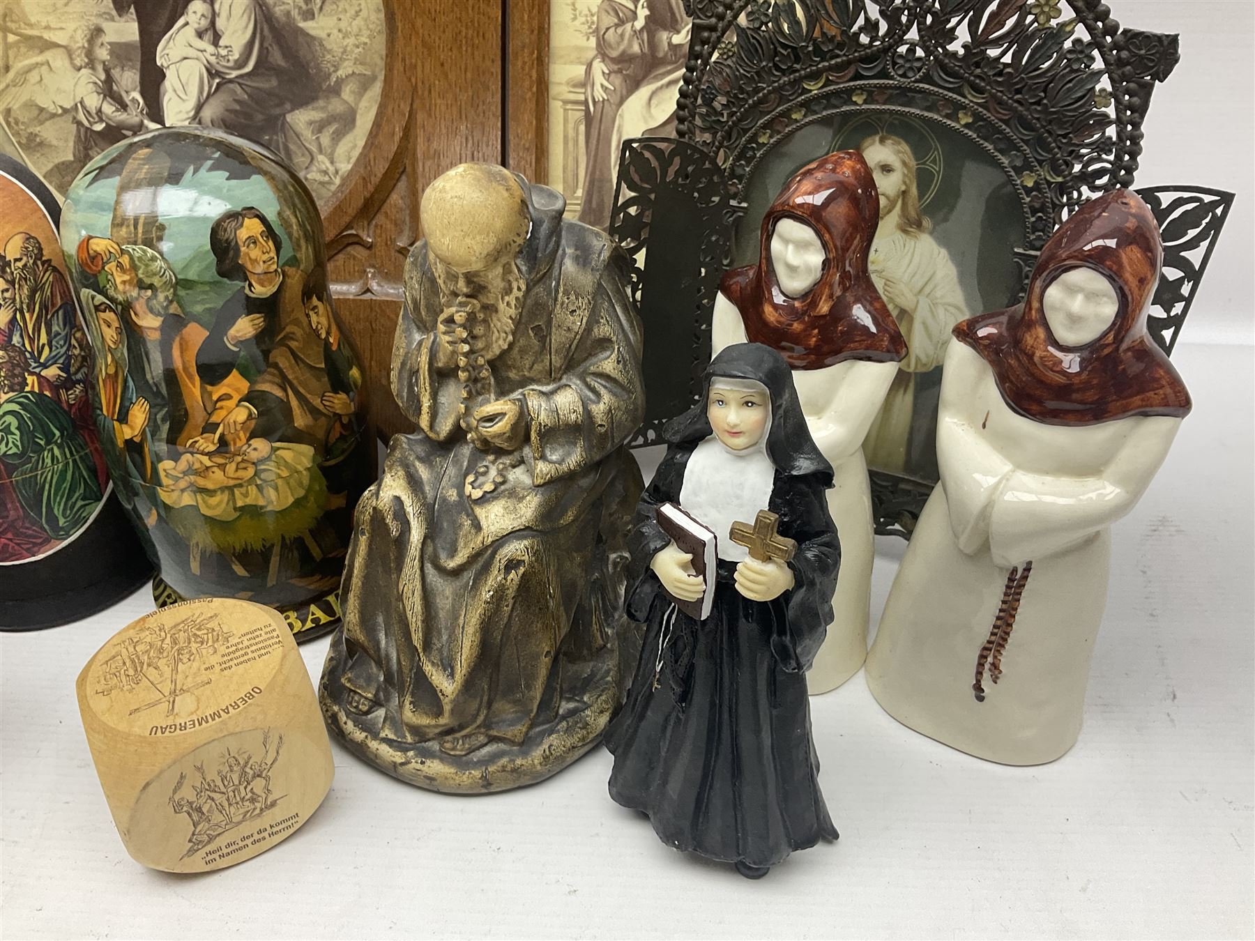 Franklin Mint House of Faberge 'The Nativity' ceramic egg, together with a Russian doll decorated with nativity scenes, Cinque Ports Pottery monk salt and pepper shaker and other monk figures, etc