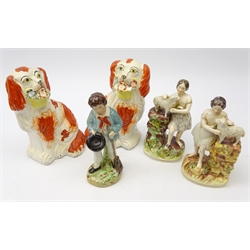  Matched pair Victorian Staffordshire figures of a girl with lambs and boy with broom and pair Staffordshire dogs holding flower baskets, H22cm (5)  