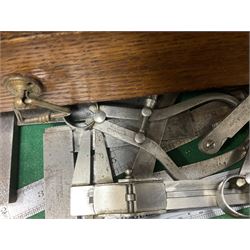 Six shelved cabinets for displaying ‘00’ gauge locomotives comprising plain plywood and white painted examples with track applied to various shelves, largest H63cm, W107cm, D27cm; Collection of tools for building model locomotives to include Weller PU-2D Soldering Pencil and Standard Tip Soldering Iron 20W/230V, Humbrol Modellers Airbrush, Power Supply Units and two wooden chests one of which housing a collection of tools including tweezers, scalping tools, wrenches etc 