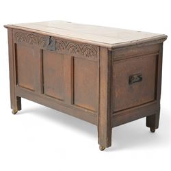 18th century oak blanket box, moulded rectangular hinged lid over lunette carved frieze rail and panelled front, moulded frame and panelled sides fitted with carrying handles, on stile supports