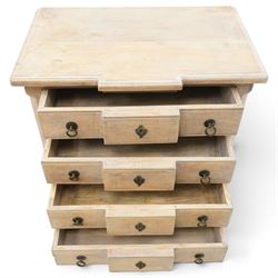 ML DS OKA - French design chest of drawers with limed oak finish, moulded breakfront top over four long drawers with metal ring handles and decorative escutcheons, panelled sides and shaped apron, on cabriole supports