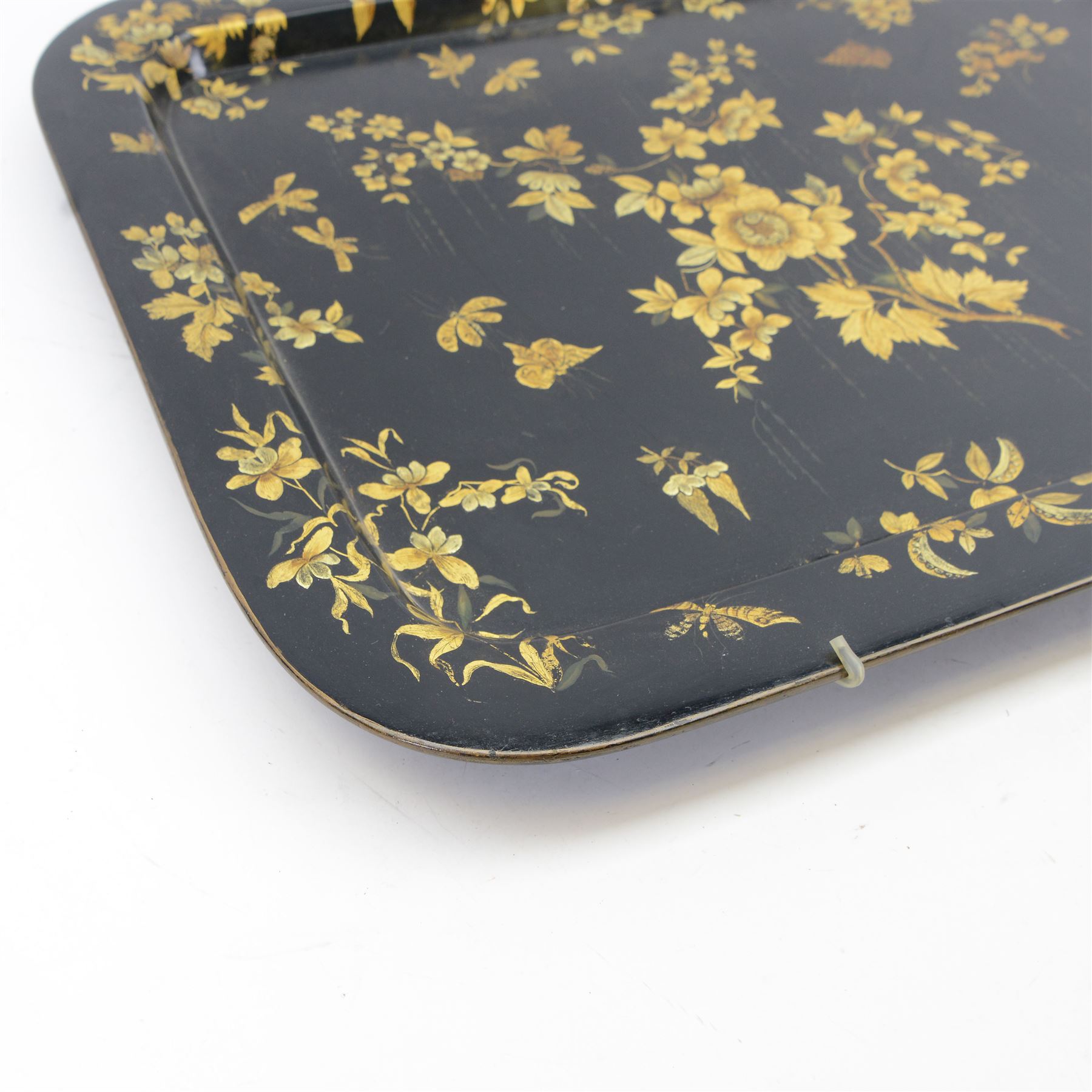 Large 19th century black lacquered papier-mâché tray, of rounded rectangular form, painted in gilt with floral sprays and butterflies, W77cm D58.5cm