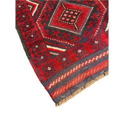 Meshwani red and blue ground runner decorated with six lozenge medallion within overall geometric design