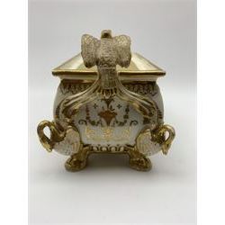 19th century Coalport bough pot, circa 1820, of bombe form, the body with twin handles surmounted by two birds and raised upon four feet modelled as swans, hand painted with two panels depicting an urn of flowers set against a mountainous landscape, the whole heightened in gilt throughout, H13cm L21cm