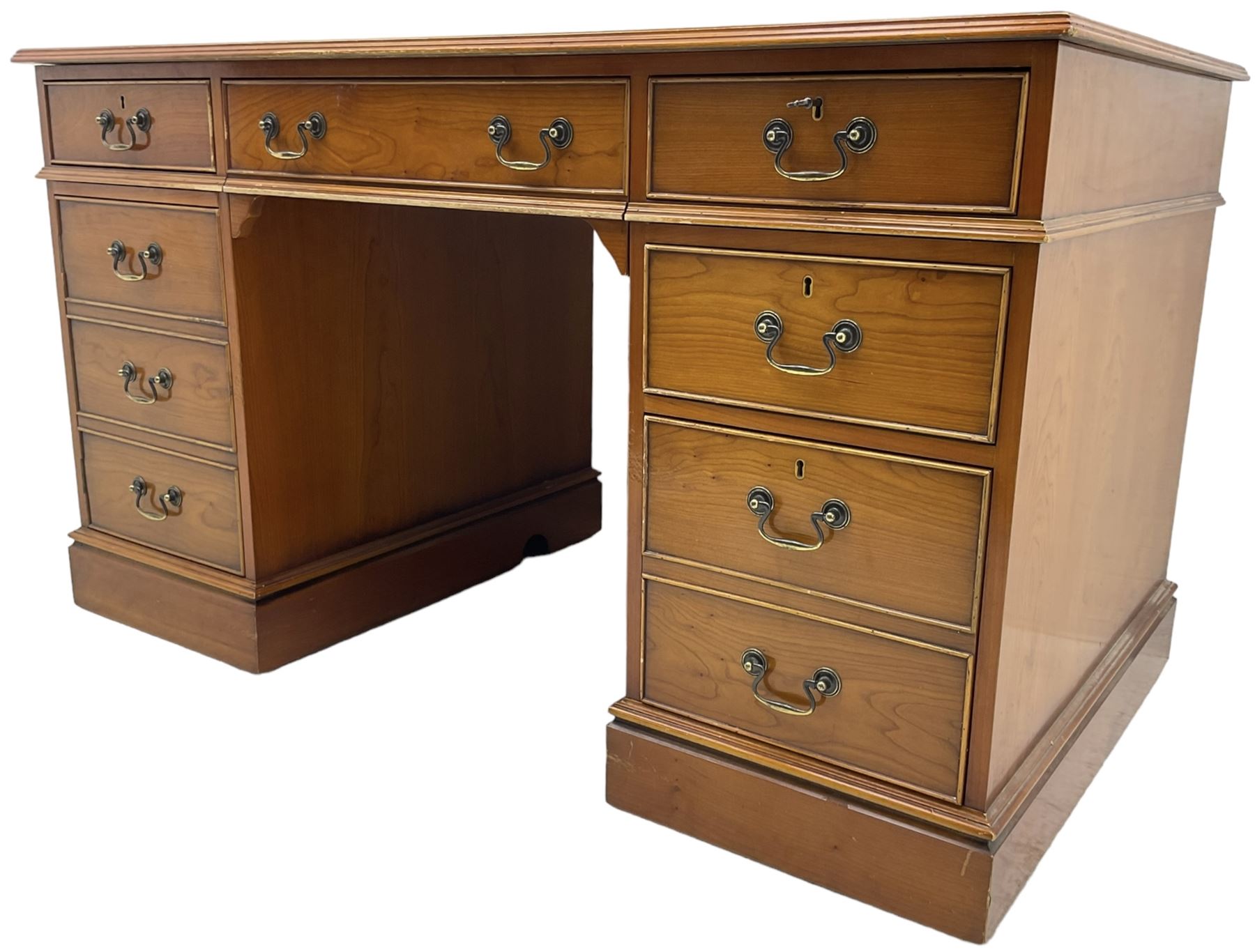 Cherrywood twin pedestal desk, rectangular leather inset top over central fall front with keyboard slide and two drawers, fitted with two drawers and cupboard, on bracket feet