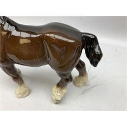 Four Beswick horses in bay, comprising rearing horse no.1014, Shetland pony no.1033, Shetland foal no.1034 and action Shire horse no.2578, all with printed or impressed marks beneath 