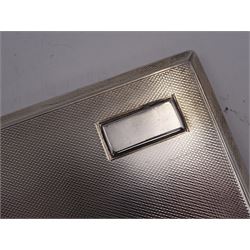 1930s silver cigarette case, of rectangular form, with engine turned decoration and vacant rectangular panel to top right corner, hallmarked E J Trevitt & Sons, Chester 1933