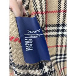 Ladies Burberry double breasted trench coat, with belt and detachable woollen gilet, in traditional cream colour with Burberry check lining, together with a gentlemans Burberry single breasted trench coat, both L112cm