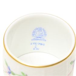 Set of twelve Herend porcelain napkin rings painted with trailing flowers and leaves on a moulded ground