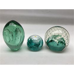 Three millefiori paperweights, together with a green glass dump paperweight with air bubble inclusions, Caithness Daisy and Cauldron paperweights and two small Caithness glass vases, tallest H9cm