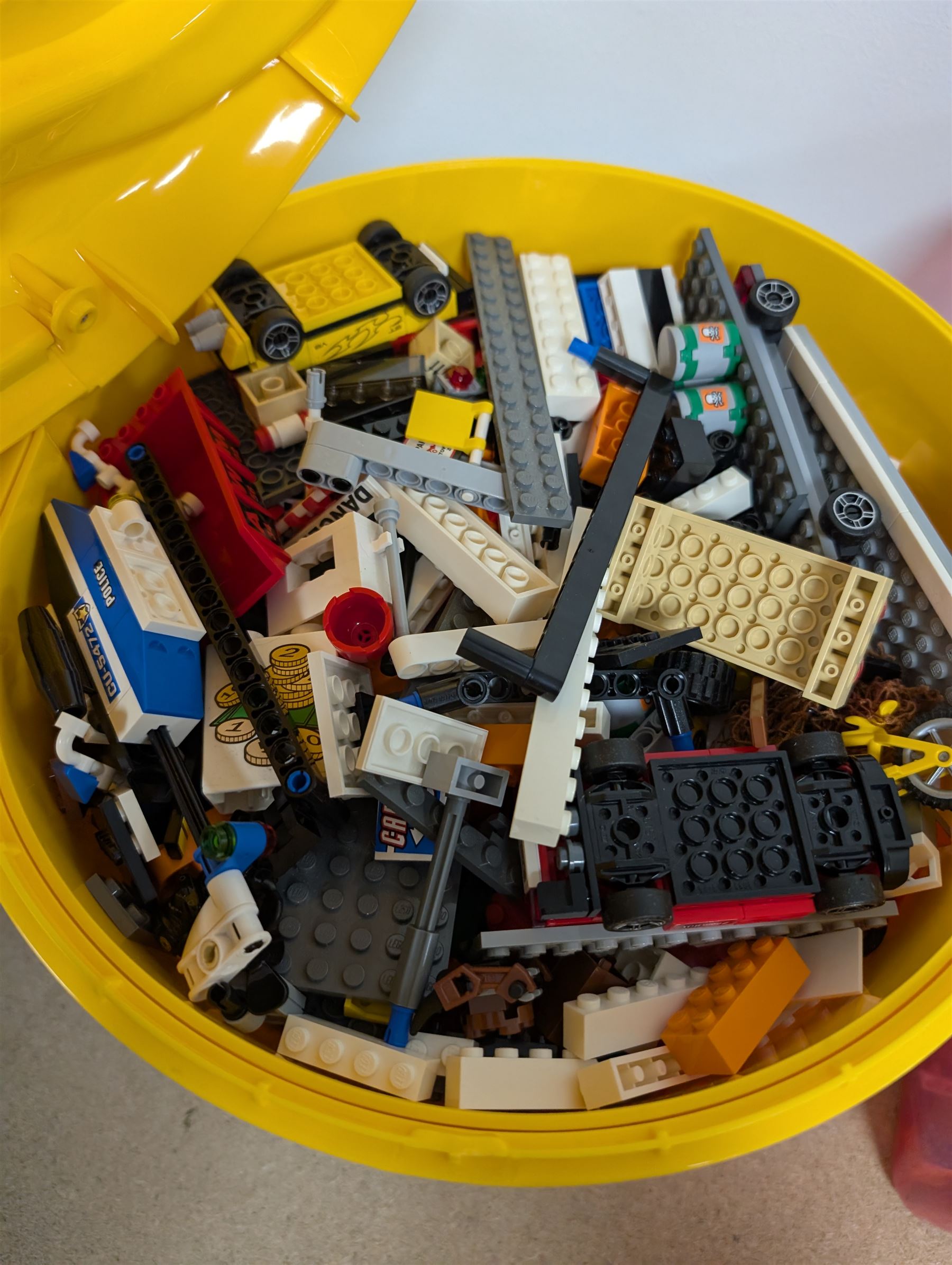 Collection of Lego, including built Bionicles Mistika models with instructions, loose Lego pieces, Lego Beatles Abbey Road canvas print and a Lego head storage box