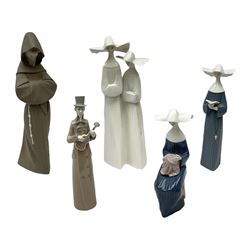 Three Lladro figures of nuns comprising Prayerful Moment no. 5500, Time to Sew no. 5501 and Two Nuns model no. 4611, together with figure of a monk no. 2060, and further Lladro bell figure