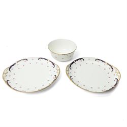 Wedgwood tea service decorated with floral sprays within a blue and gilt border comprising five cups, ten saucers, seven plates, two bread and butter plates, milk jug and sugar bowl