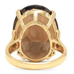 14ct gold smokey quartz ring, four claw set with a single oval cut quartz, stamped