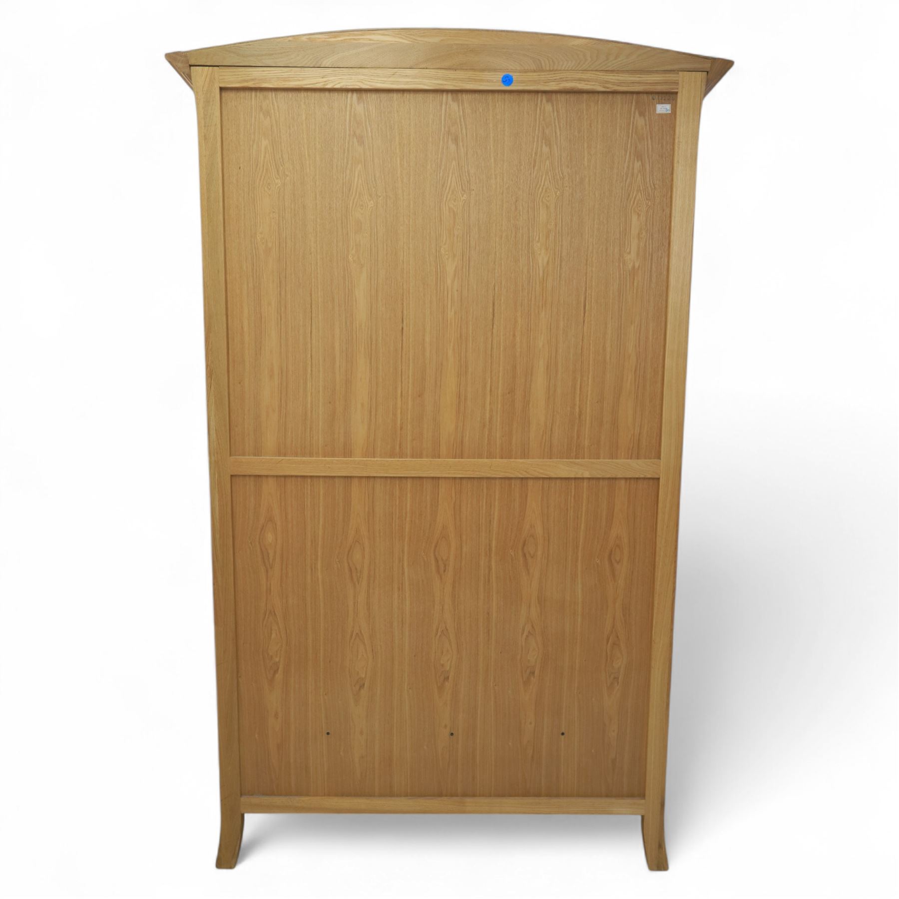 Contemporary oak double wardrobe, with fitted hanging rail above two drawers, raised on splayed feet