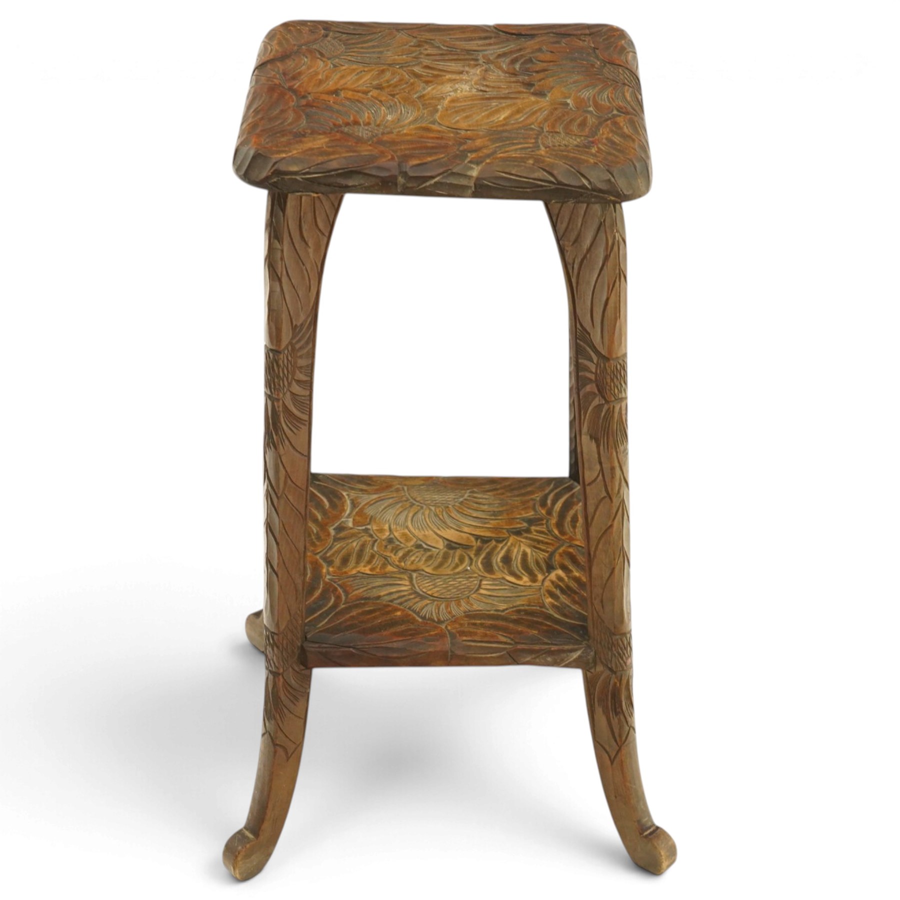 Attrib. Liberty & Co. - Arts & Crafts carved Japanese pattern two-tier occasional table, the square top with rounded corners heavily carved foliate motifs, raised on tapering supports with scroll feet united by undertier