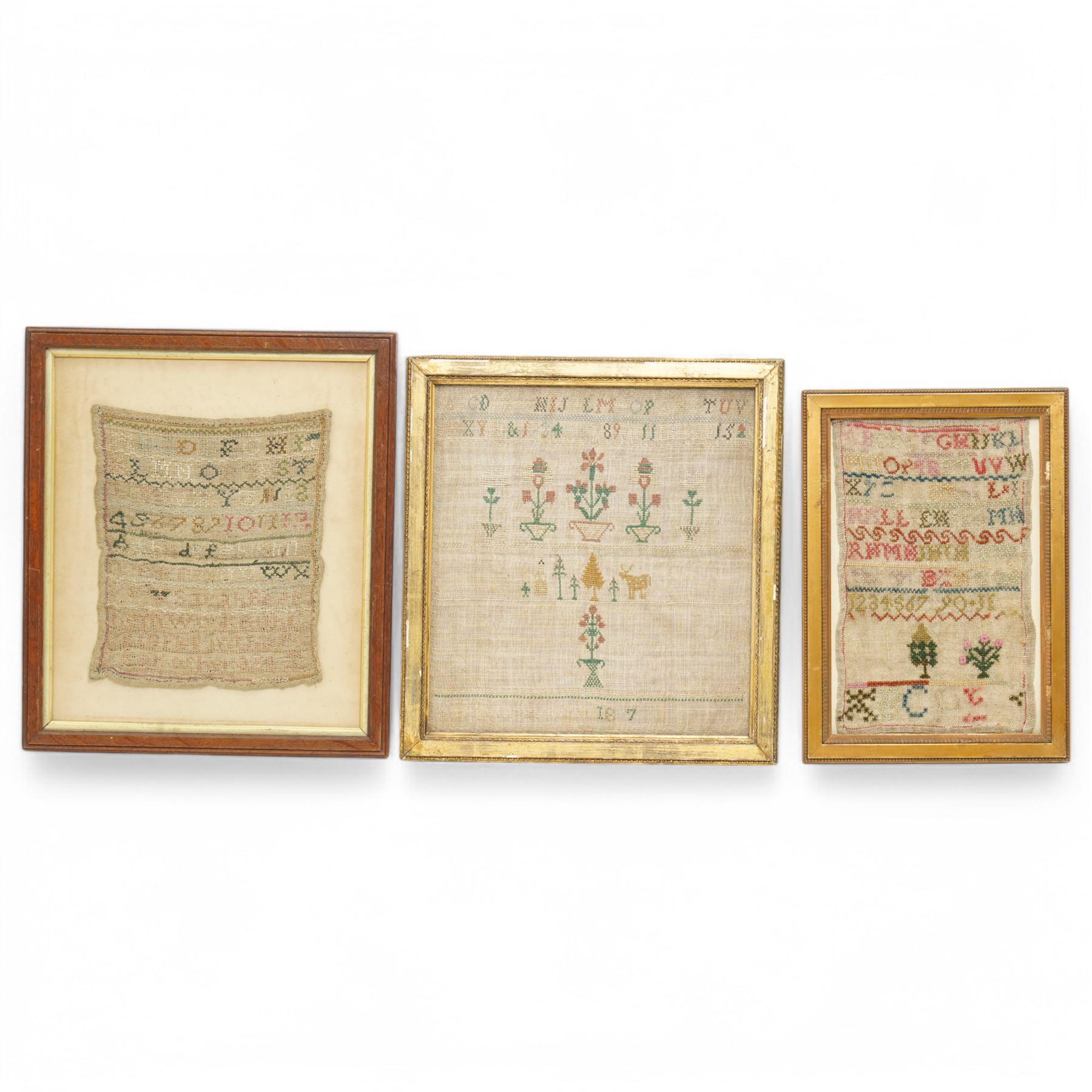 Early 19th century alphabet sampler by Sarah Beetham, with verse 'Sarah Beetham worked thif sampler in the 9 year of her age', together with two other early samplers, one by Eliza Popple of Gosberton, dated c. 1847, worked with alphabet, foliate and deer motifs, largest 32cm x 29cm (3)
