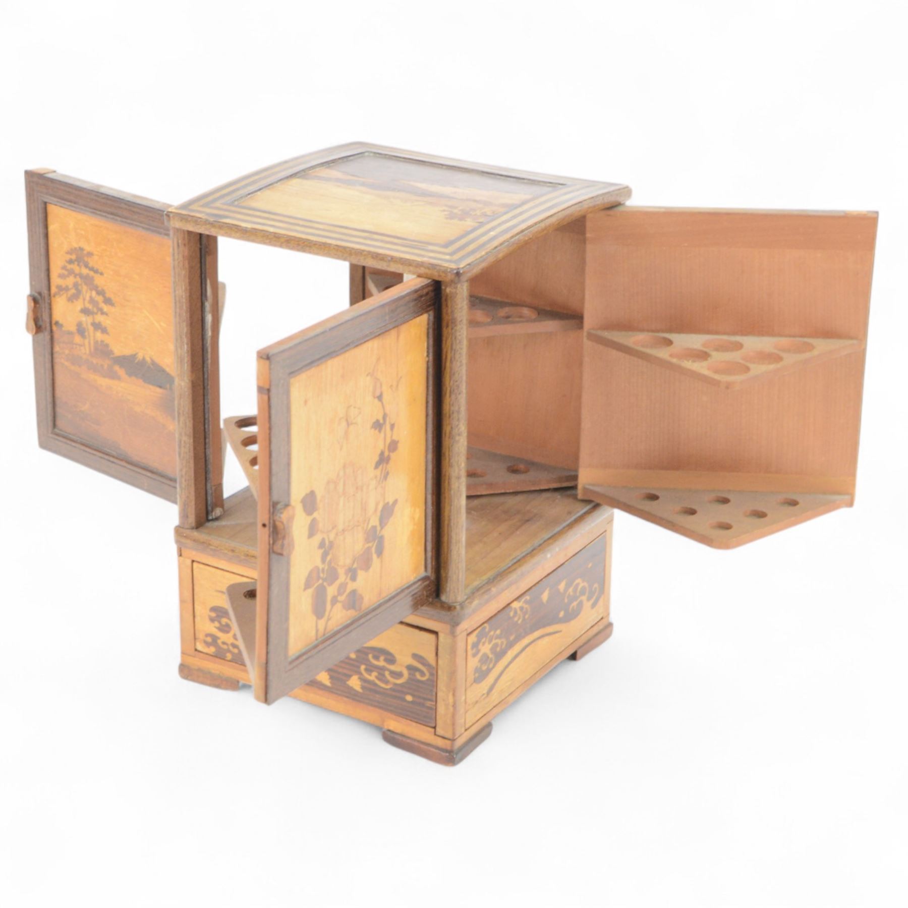 Desktop smokers cabinet, with an inlaid marquetry scene of Mount Fuji, the sides opening to reveal fitted pipe racks, H25cm