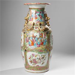 Cantonese famille rose vases, of inverted baluster form, the domed cover with gilt dog of Fu finial, H38cm; together with a further pair of Cantonese vases, each with double Buddhist lion handles and applied at the shoulders with chilong, H45cm (3)