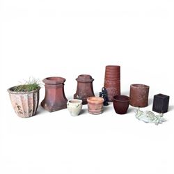 Two Victorian terracotta octagonal squat chimney pots, three other pots, terracotta planter, three small planters, cast iron fox door stop and a cherub wall pocket