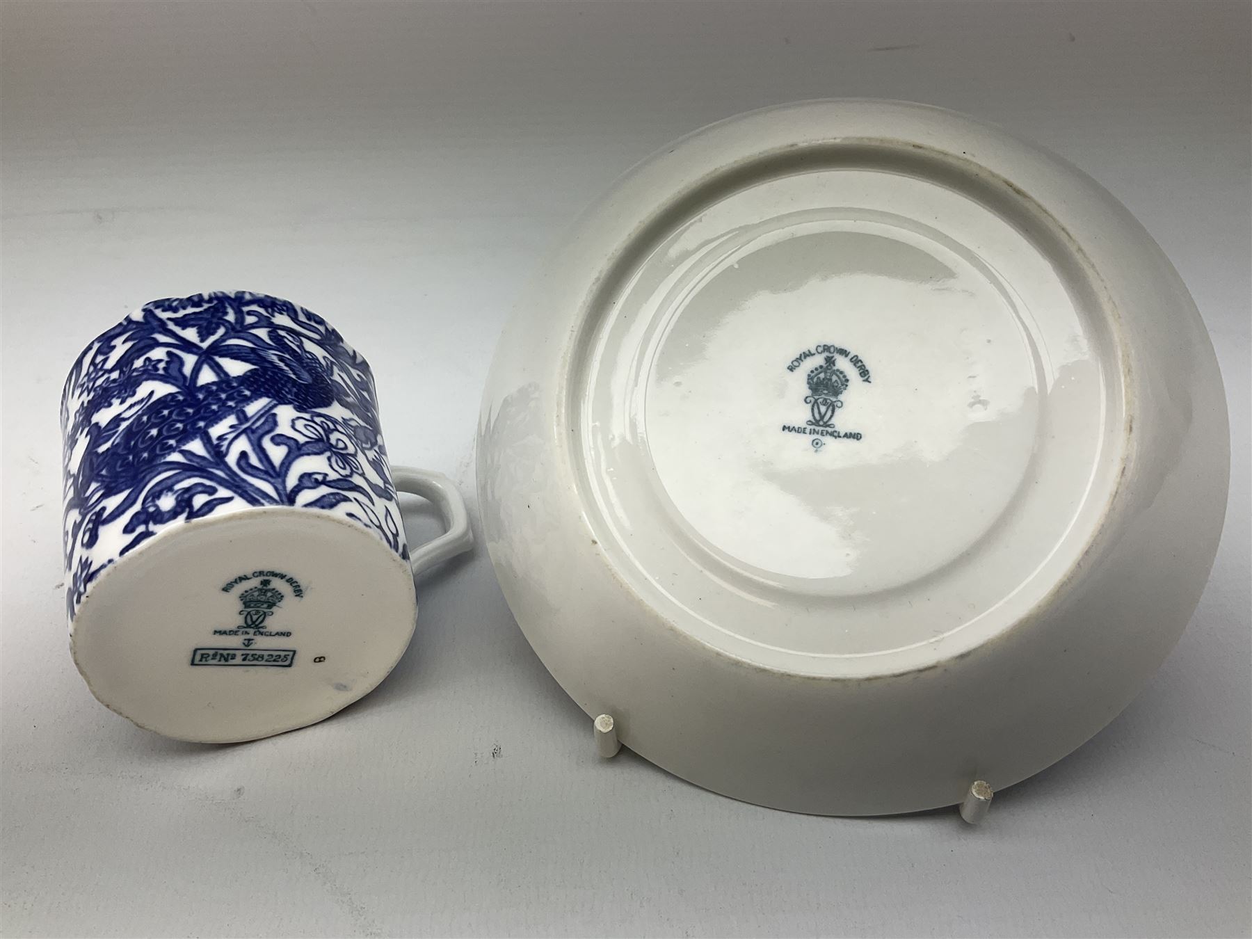 Late 19th Century pot lid bearing ‘The Residence of Anne Hathaway, Shakespeare’s Wife’ below printed decoration of thatched houses and animals scene, Royal Crown Derby Chinoiserie pattern coffee can and saucer, Rd No 758225, and an oval trinket box with gilt decoration bearing interlaced L mark to base (4)