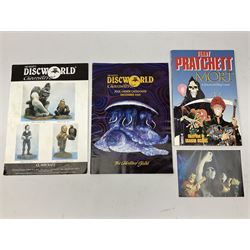 Terry Pratchett Discworld figures, designed by Clarecraft, comprising Mrs Gogol's house DW67, Death DW05, Windle Poons DW58, Death Swinging Scythe DW05A, Book Stamp from the Unseen University DW40, together with Mort a discworld big comic and discworld collectors manuals  