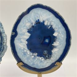 Pair of blue agate slices, polished with rough edges raised upon gilt metal stands, H22cm