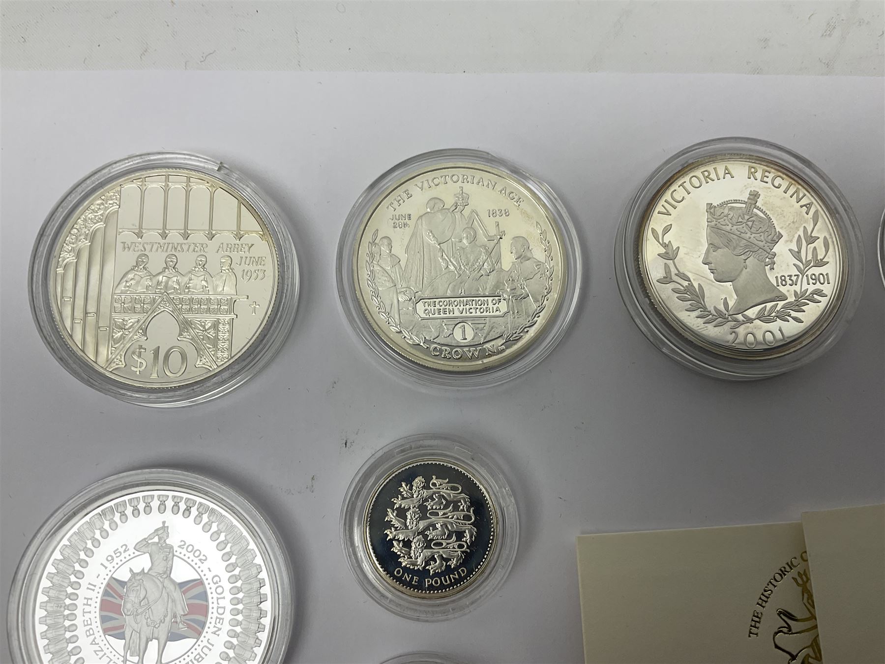 Thirteen silver coins, including Queen Elizabeth II Solomon Islands 2002 sterling silver five dollars, Alderney 2002 sterling silver five pounds, Fiji 2002 sterling silver ten dollars, United Kingdom 2003 one ounce fine silver Britannia, 2003 'Give Women The Vote' fifty pence etc, all with some form of certificate