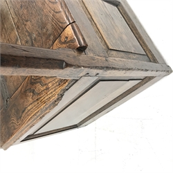 18th century oak box seat settle, panelled back, cresting rail initialled 'T.I', the moulded seat with hinged lid, down swept arms on octagonal faceted supports, fielded panelled base, engraved brass escutcheon initialled again 'T.I', W80cm, H149cm, D59cm
