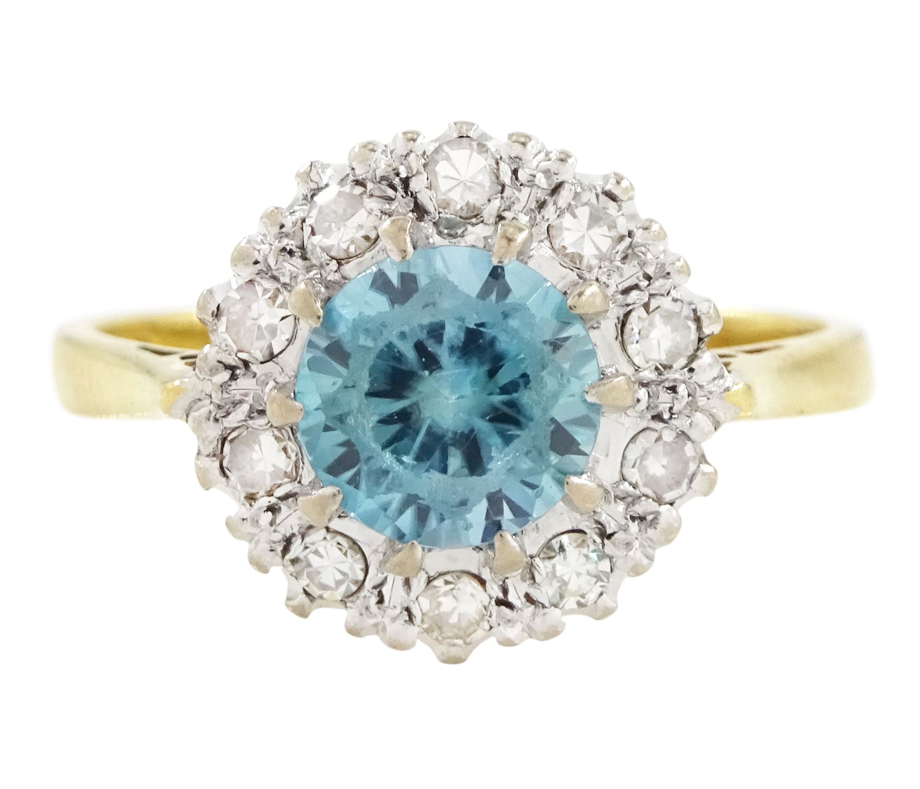 18ct gold blue zircon and diamond cluster ring, single round cut blue zircon surrounded by ten single cut diamonds, London 1965