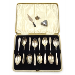  Silver trowel book mark, miniature funnel both hallmarked, triangular pill box stamped 900 and a set of eight Art Deco silver teaspoons Sheffield 1935  