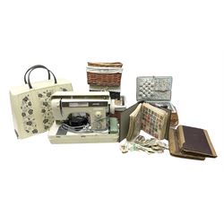 Jones 461 sewing machine, together with sewing equipment, various wicker baskets and a collection of cigarette cards 