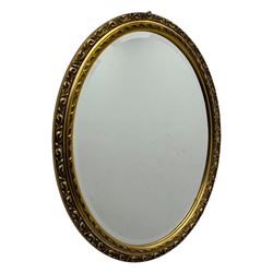 Four decorative mirrors, including gold-toned triptych dressing mirror with foliate borders, two rectangular framed mirrors and a circular gilt mirror with ornate edging