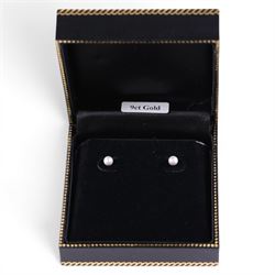Pair of 9ct gold pearl stud earrings, boxed