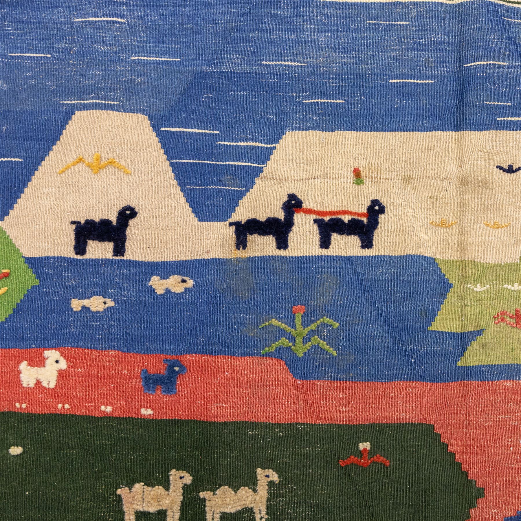 South West Persian Qahgai pictorial flatweave kilim, design arranged in a series of irregular vertical bands in shades of indigo, blue, madder red, pink, green, and ivory, each band filled with naïve pictorial and symbolic motifs of stylized human figures, sheep, goats, and birds