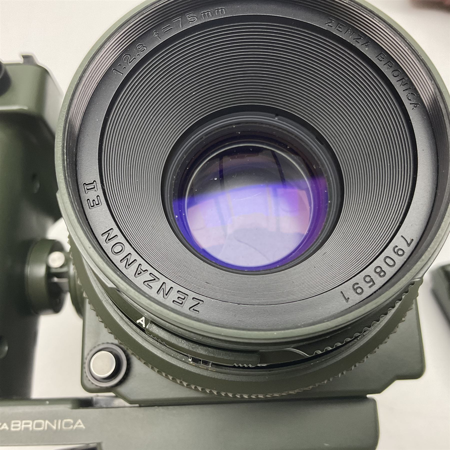 Zenza Bronica ETRS camera body, safari edition, serial no. 7100811, with 'Zenza Bronica Zenzanon EII 1:2.8 f=75mm' lens, serial no. 7908591, film magazine back, safari, serial no. 8100564, AE-ii metering head, safari, serial no. 617024, etc, all in leather case