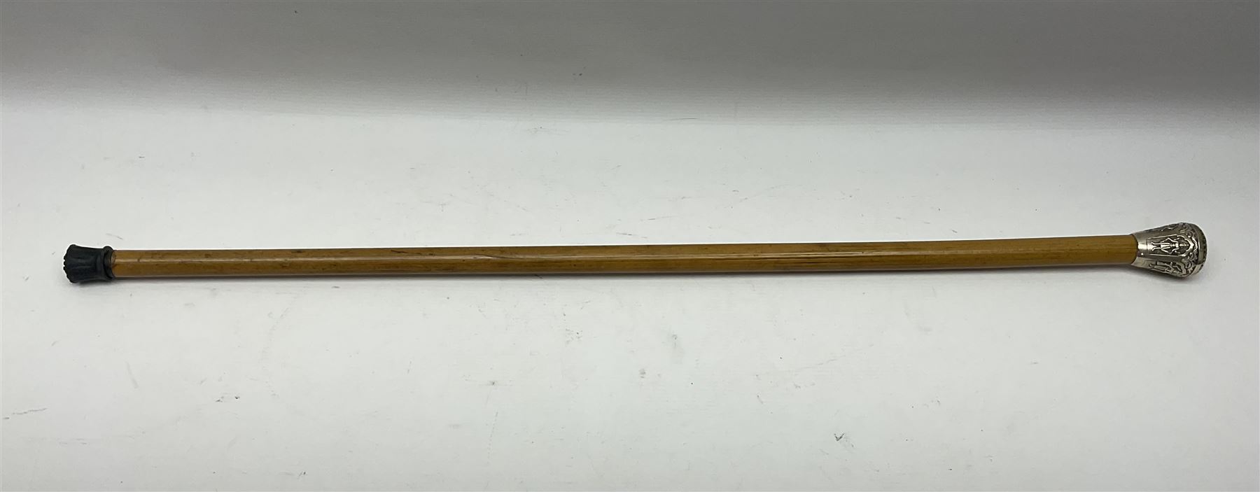 Malacca walking cane, with domed Burmese silver pommel embossed with deities, L91.5cm
