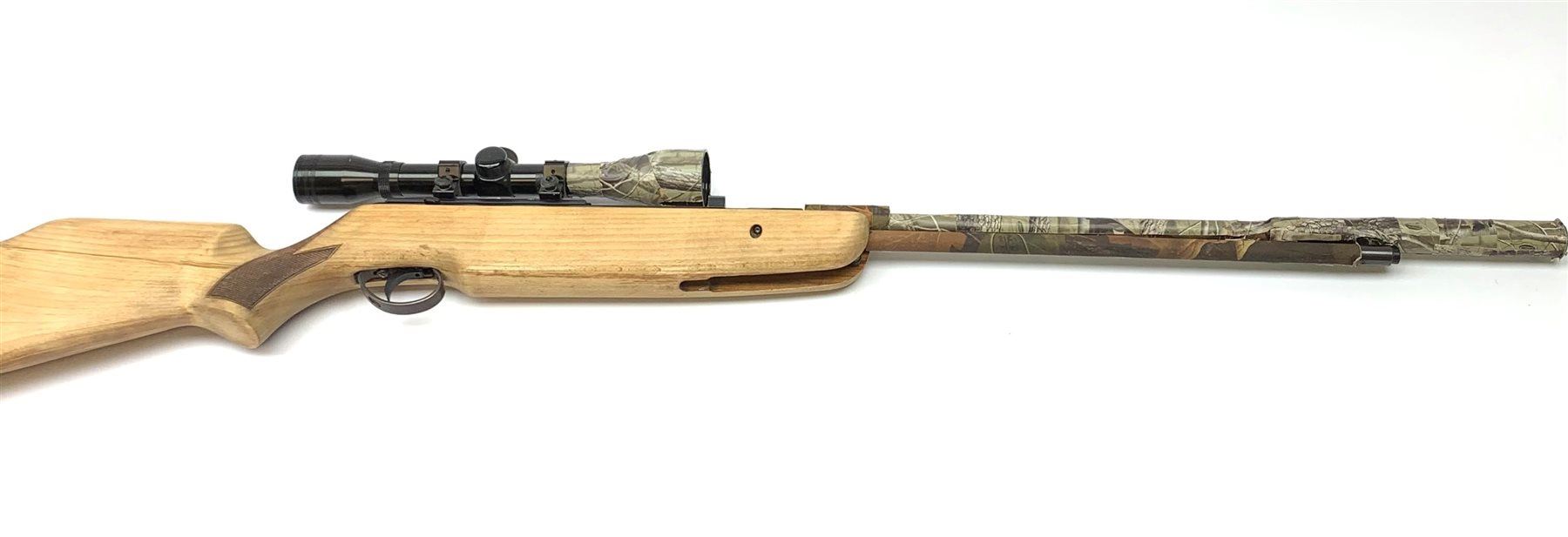 .22 air rifle with under lever action, chequered pistol grip, adjustable butt, camo covered barrel and Nikko Stirling 6x scope L120cm overall