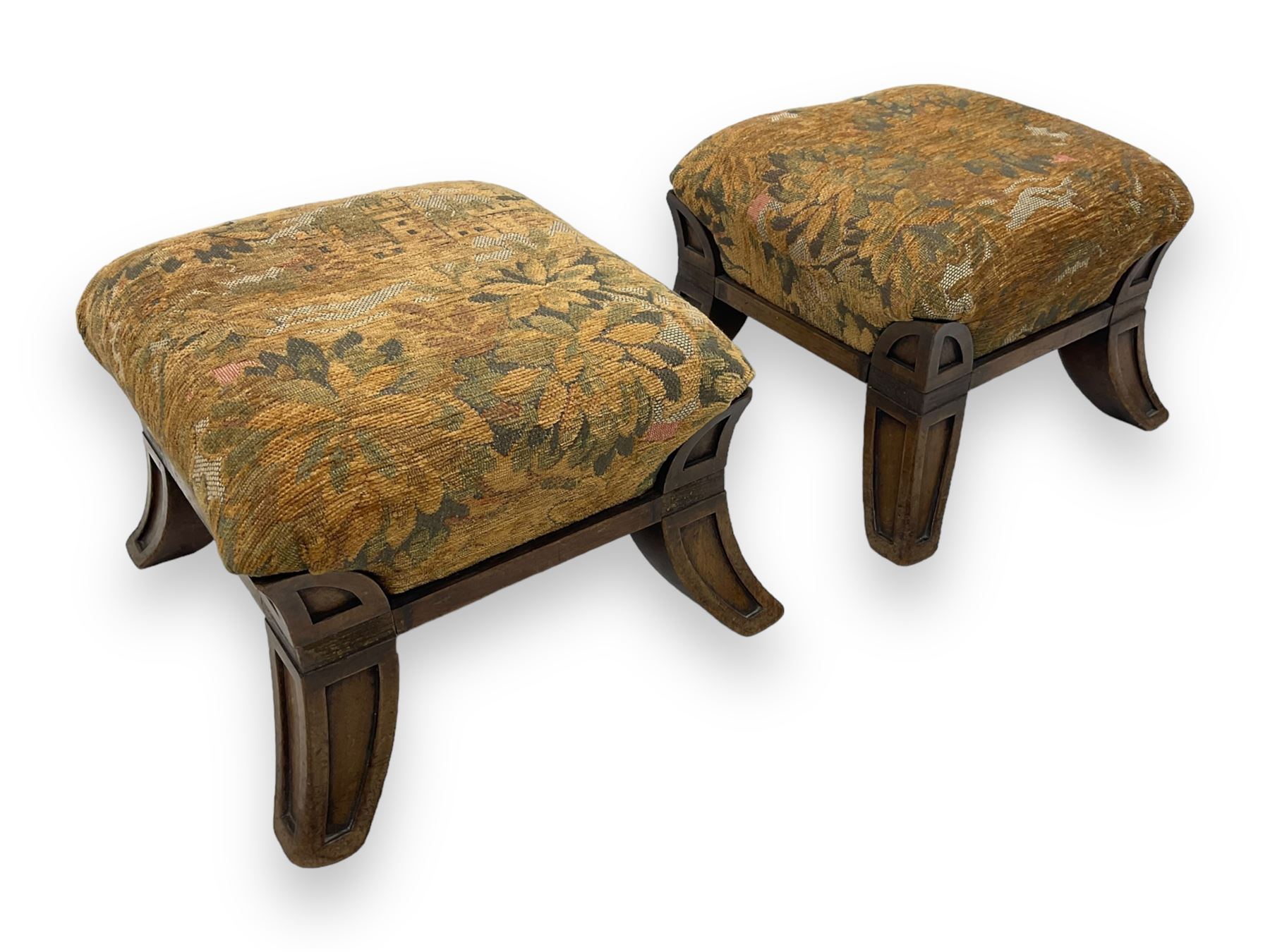 Pair of early 20th century miniature footstools, square seat covered in gold and orange floral patterned tapestry fabric, on carved wooden frame with splayed supports 