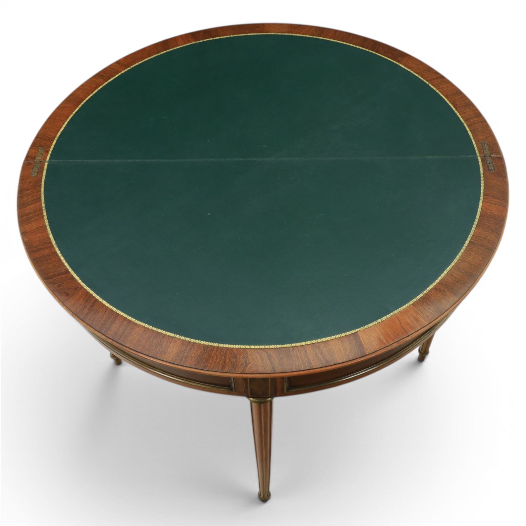 Regency revival mid 20th century walnut card table, demi lune form inlaid with boxwood, kingwood frieze with brass detail fold-over top with retractable back leg, revealing circular leather playing surface, circular tapering legs