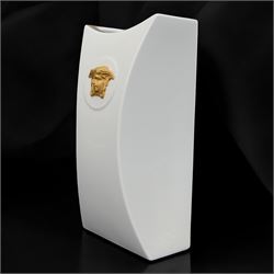 Rosenthal Versace Gorgona vase, of concave form, decorated in relief with medusa masks and gilt greek key borders upon a white ground, boxed, H25cm