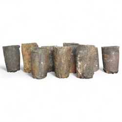 Nine lava stone iron smelting crucible pots in various conditions