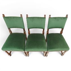 17th century style mahogany set of six dining chairs, with carved scrolled finials, padded green velvet upholstery, block and turned supports united by stretcher  